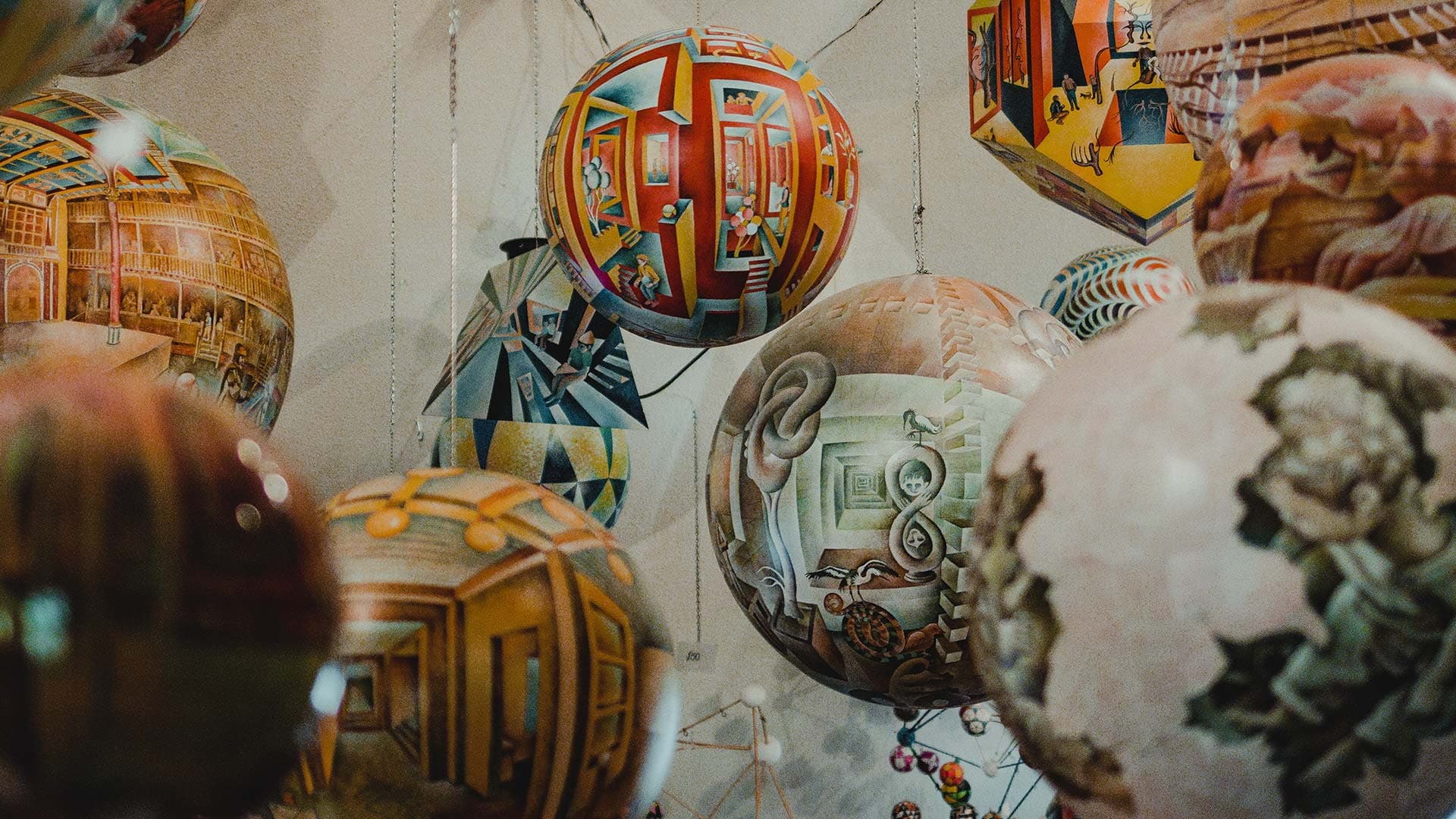 Termespheres -- art done on spheres -- hang in the artist's studio outside of Spearfish