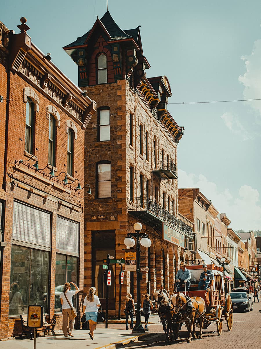 A horse-drawn wagon on the historic streets of Deadwood, South Dakota.
