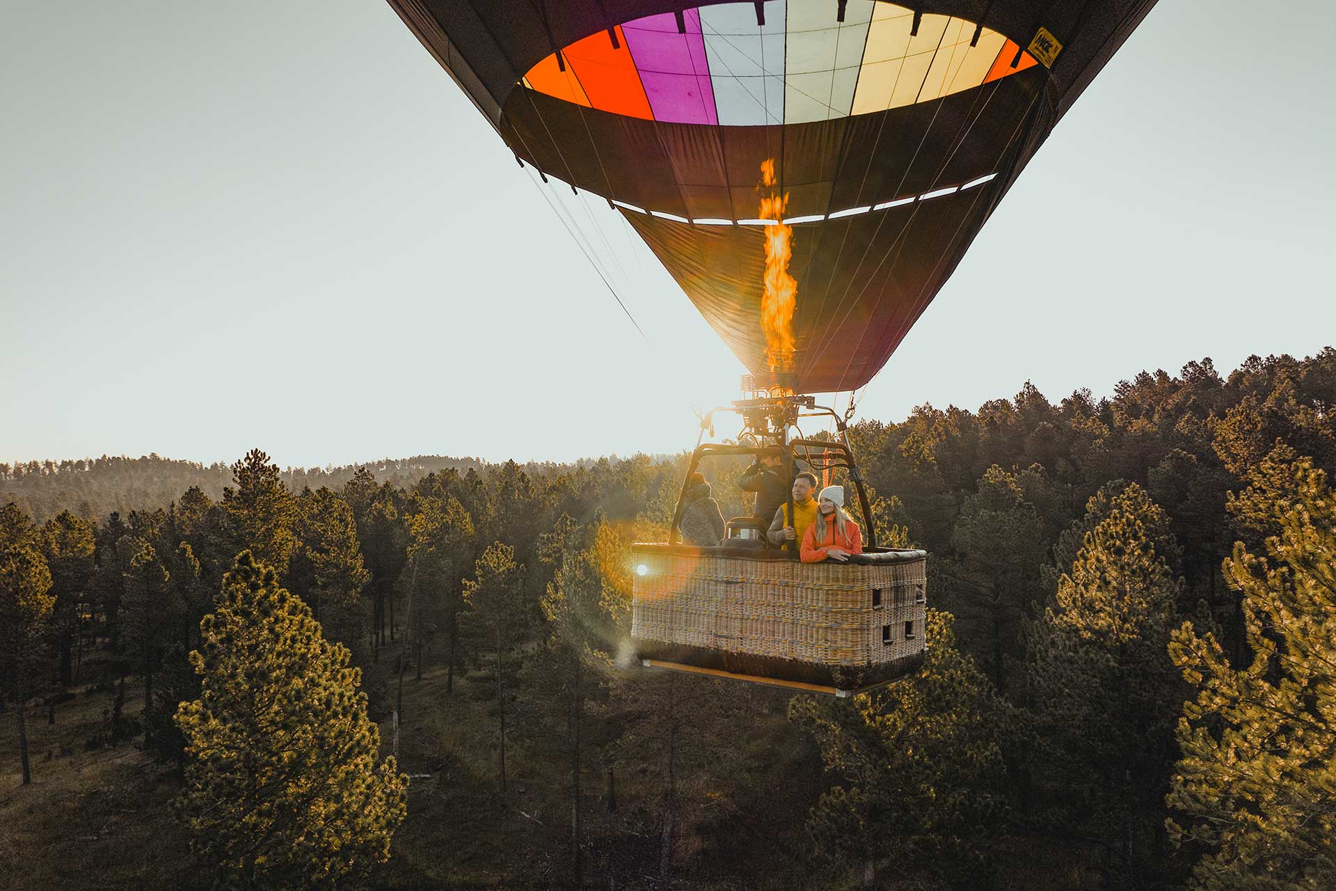 A couple rides in a hot air balloon on an aerial tour in western South Dakota.