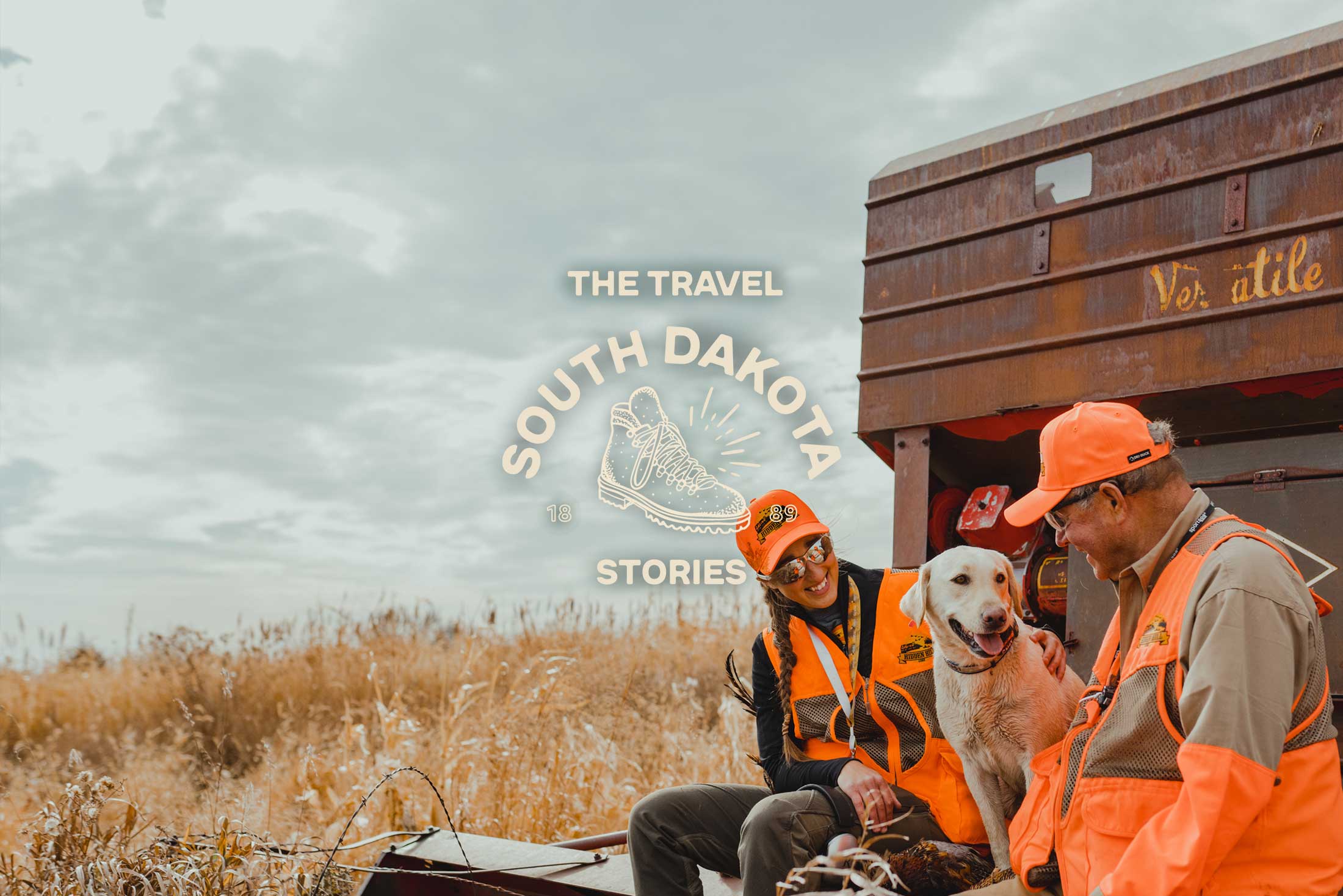 Two hunters and a dog in South Dakota.