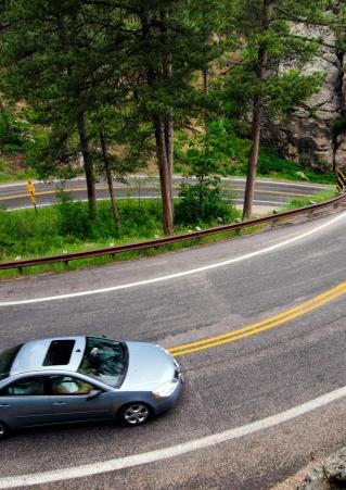 Car driving Iron Mountain Road in South Dakota