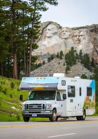 RV driving past Mount Rushmore