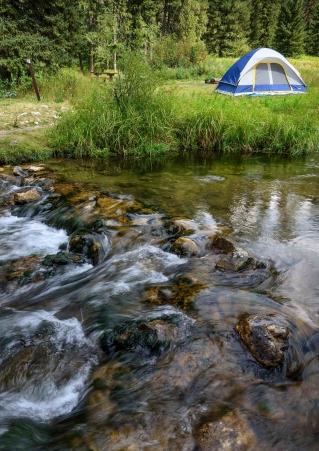 Tent and water at Hanna Campground