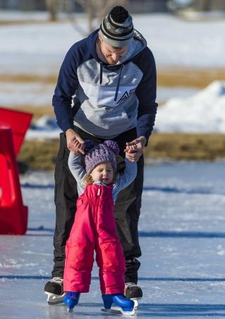 Ice Skating father and daughter