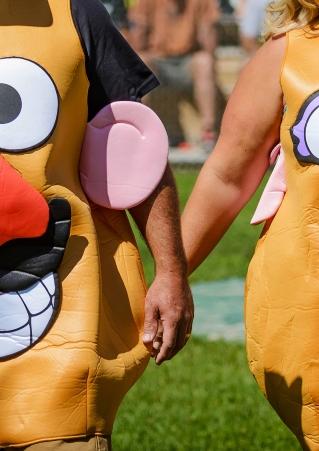 A man and woman sport Mr. and Mrs. Potato Head costumes for Potato Days in Clark, SD