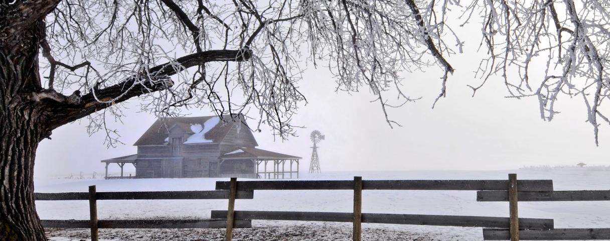 Snow with house and fence in De Smet (cropped for long)
