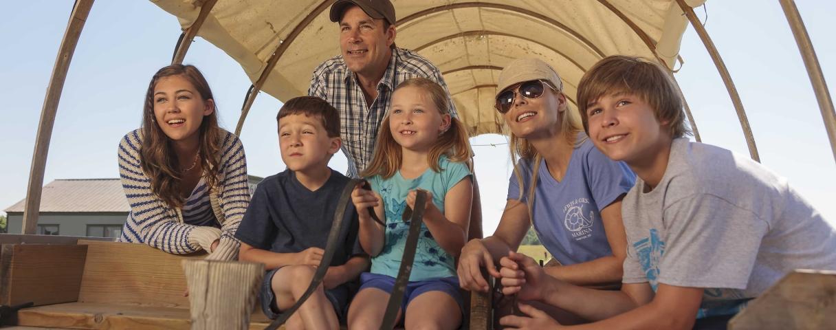 Family in wagon at Ingalls Homestead