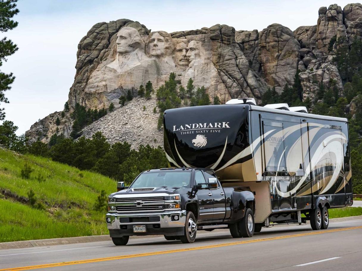 Truck pulling RV camper on Peter Norbeck Scenic Byway