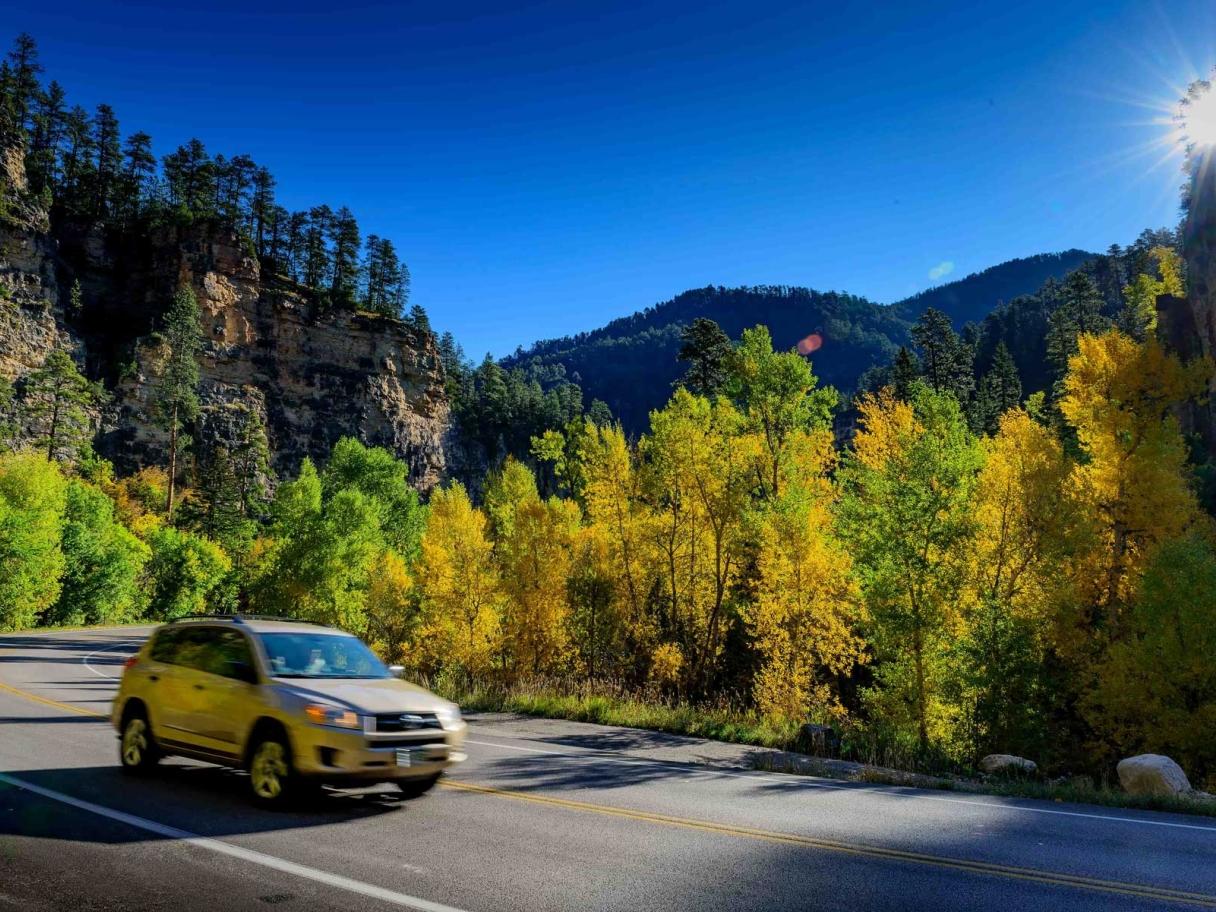 Car driving on Spearfish Canyon byway