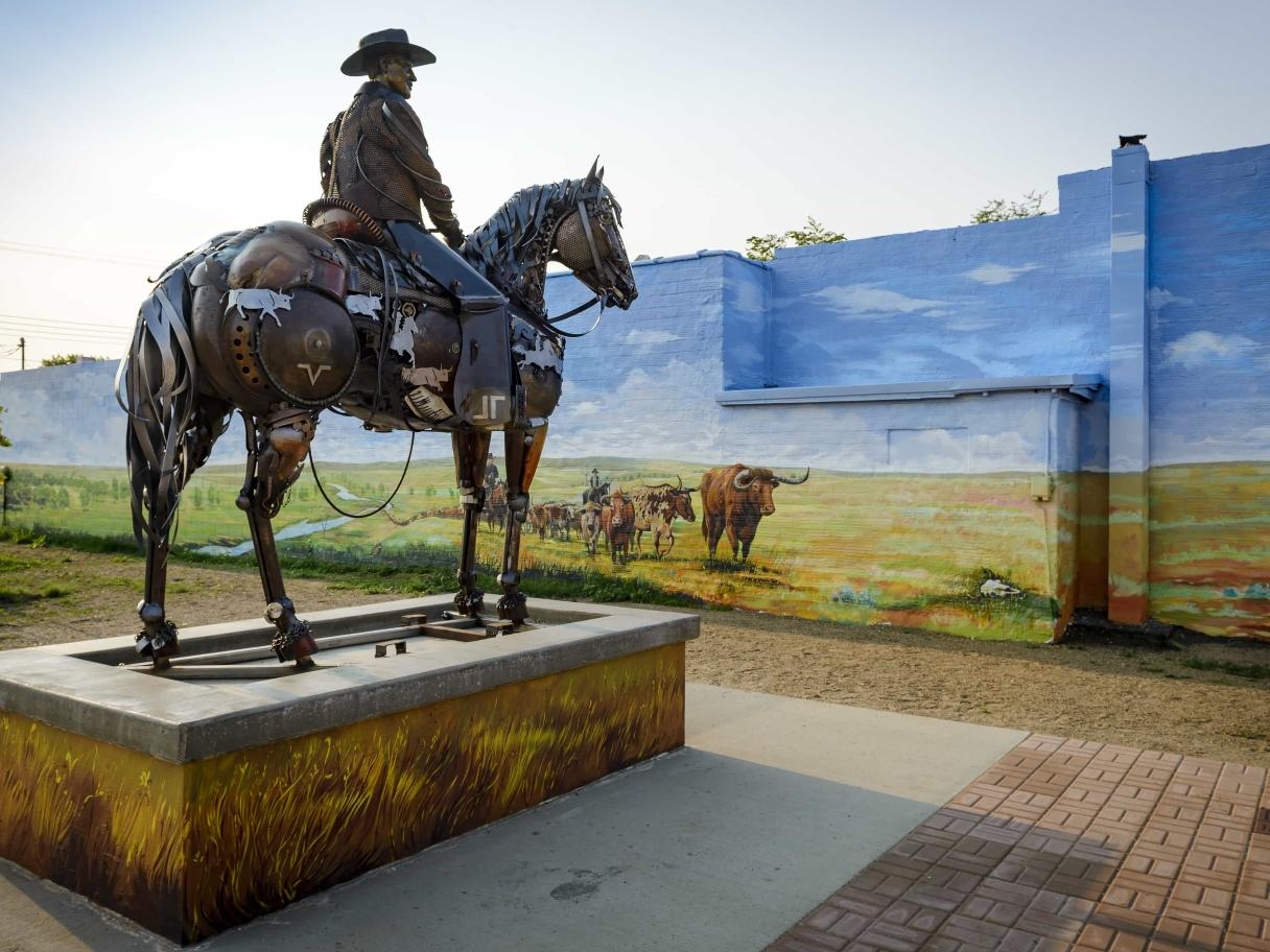 Cowboy sculpture by Lopez in Lemmon