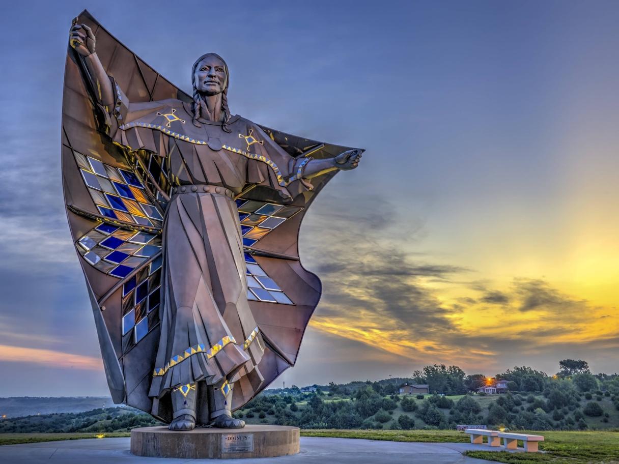 Dignity sculpture with sunset near Chamberlain