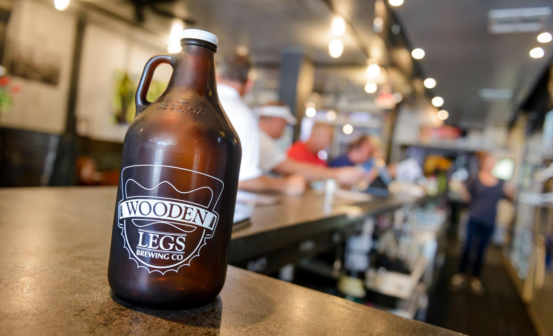 Growler on bar at Wooden Legs Brewing