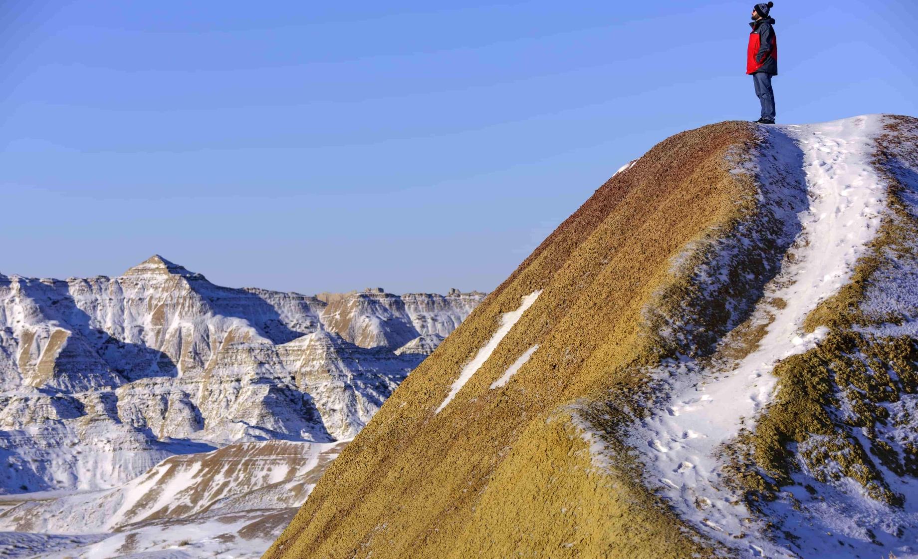 Man Standing on Badlands