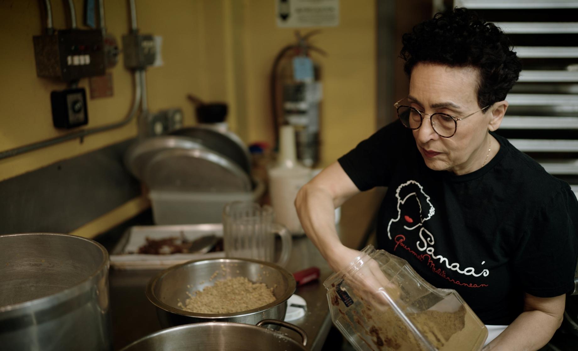 Sanaa Abourezk prepares food at Sanaa's 8th St. Gourmet in Sioux Falls