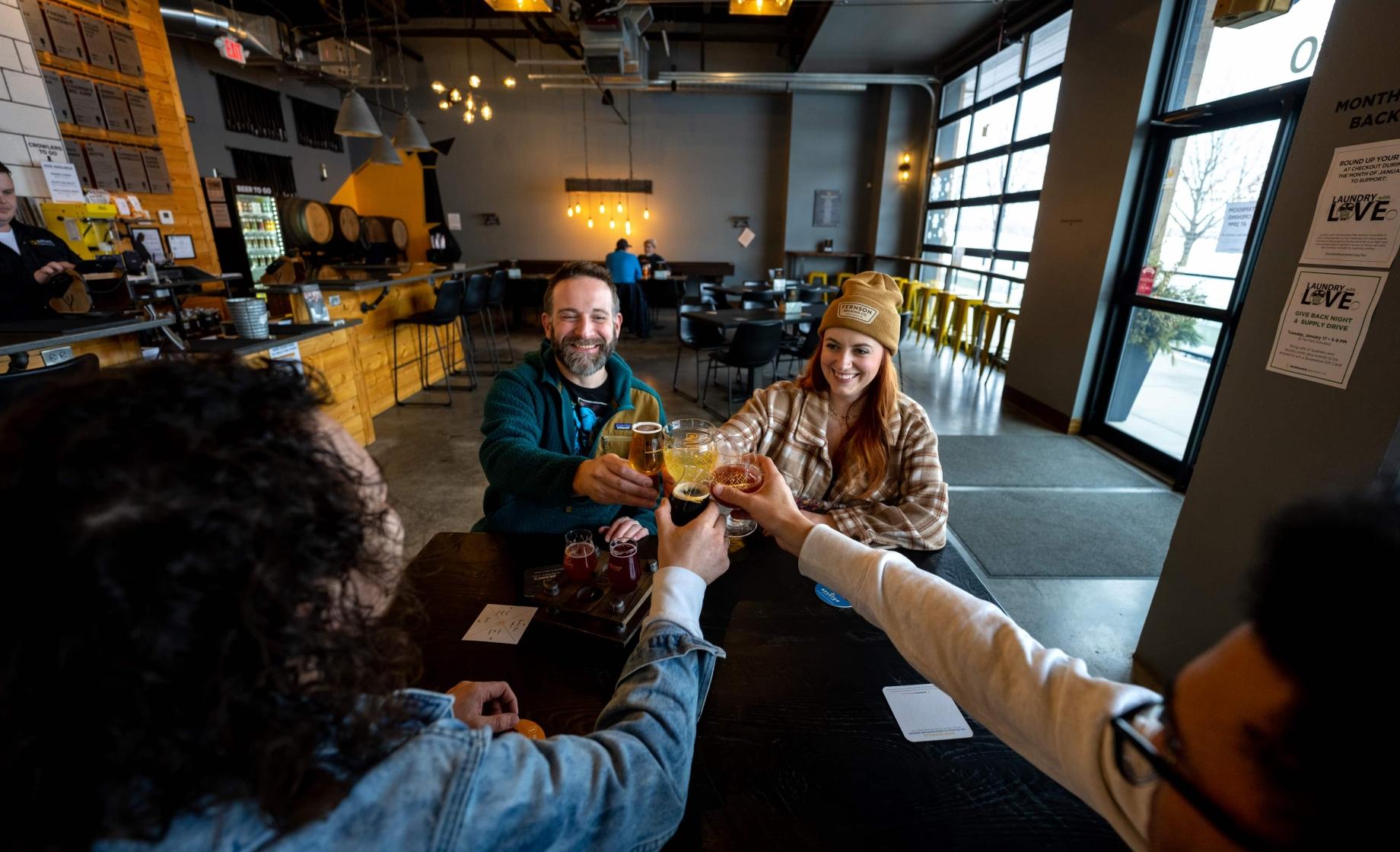 Friends cheer with beer at Severance Brewing in Sioux Falls