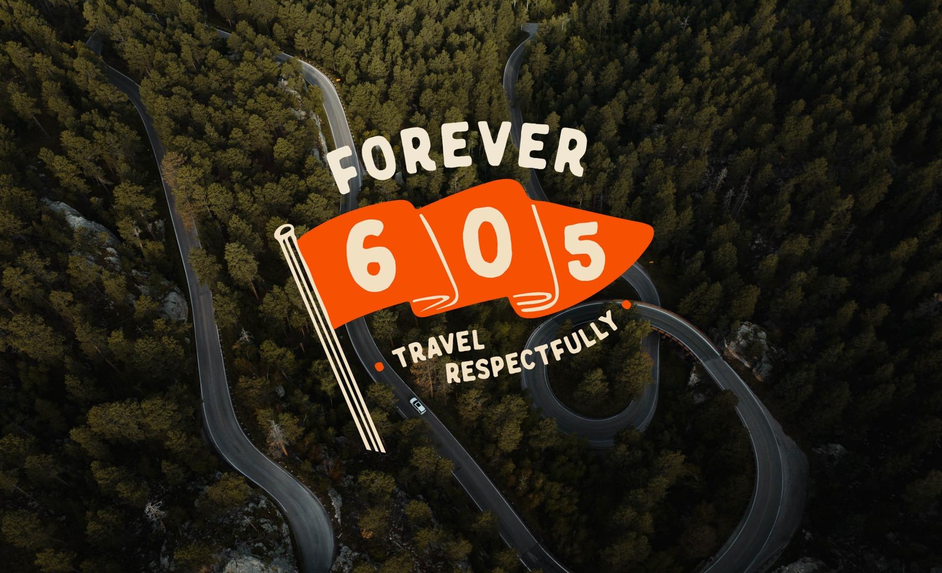 The Forever 605 logo (feature 605 on an orange flag) sits atop an overhead shot of the roads and trees of the Black Hills