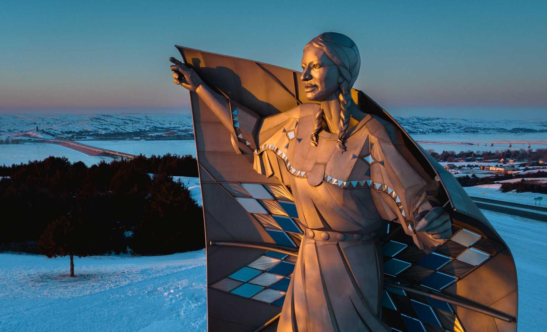 Dignity: of Earth and Sky statue in the winter at sunset