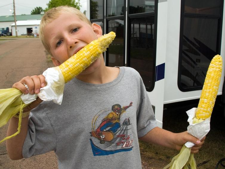 Kid with Corn South Dakota State Fair