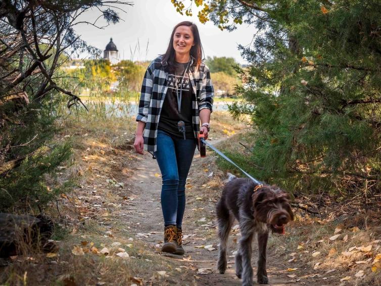 Girl Hiking with dog on LaFramboise Island trail