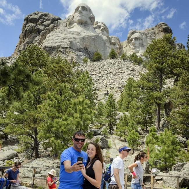 Couple taking a selfie at Mount Rushmore