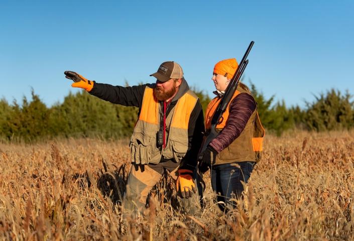 Pheasant hunters planning in field