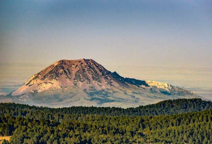 Bear Butte with mist and trees