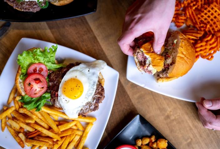 Black Hills Burger and Bun burgers on table