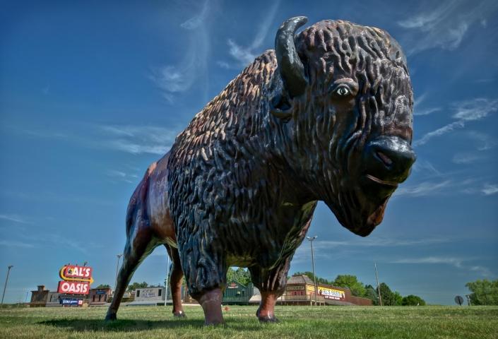 A giant buffalo statue stands outside of Al's Oasis in Chamberlain, South Dakota.
