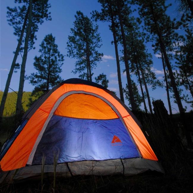 Tent illuminated at dusk