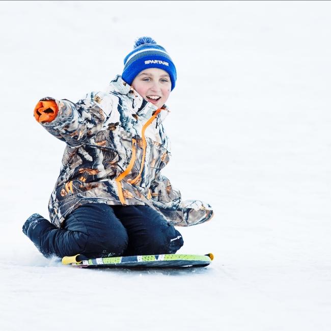 Child sledding in Wessington Springs