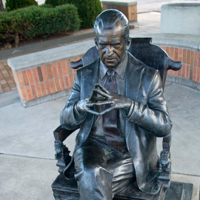 A statue of Richard Nixon casts an ominous gaze on a Rapid City street