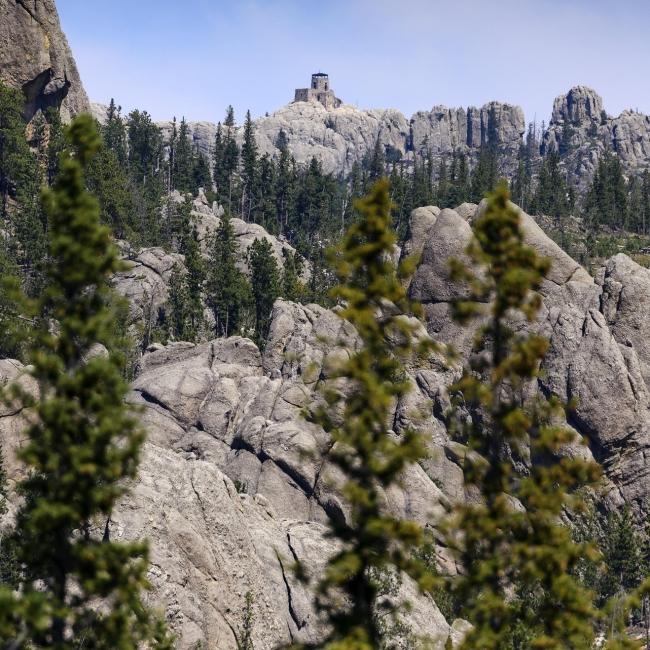 Black Elk Peak, as seen through the trees from a nearby mountain.