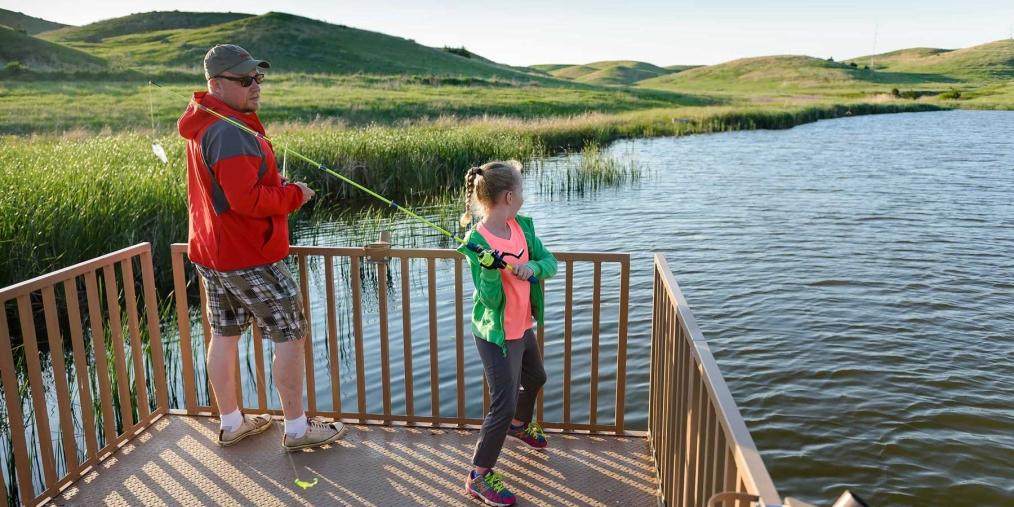Dad & daughter fishing at Mickelson Pond Pierre