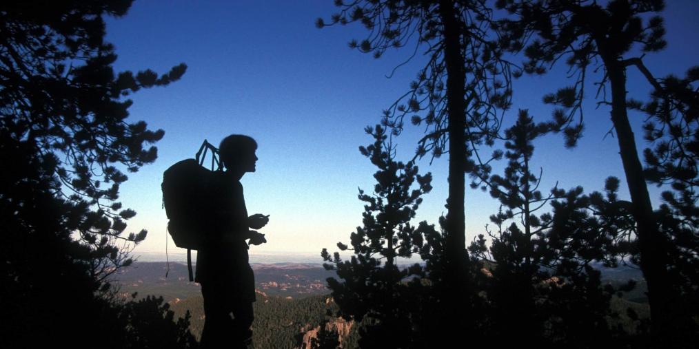 Hiker in Black Elk Wilderness at dusk