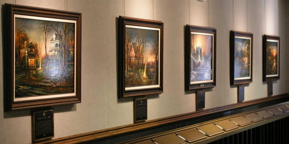 Row of paintings on a wall