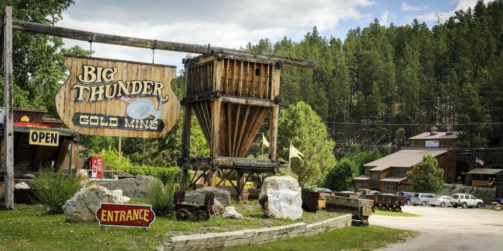 The entrance to Big Thunder Gold Mine, as advertised by a hand-painted wooden sign.