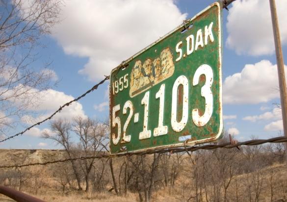License plate on fence
