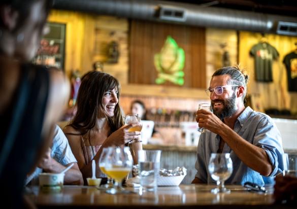 Couple drinking beer at Lost Cabin