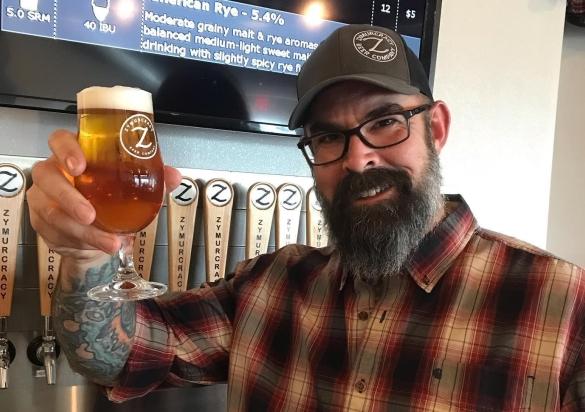 Beer and bartender at Zymurcracy
