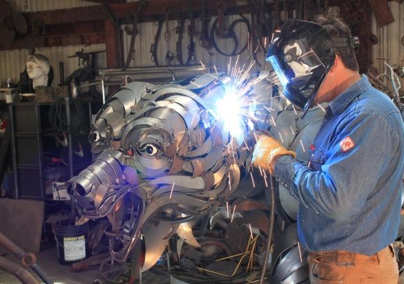 Artist John Lopez working in his studio