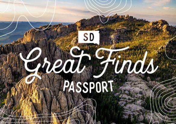 SD Great Finds Passport logo over image of the Black Hills