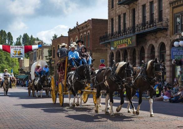 Horse-drawn stagecoaches parade through the streets of Historic Deadwood at the Days of '76 Parade.