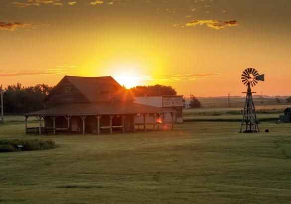 The sun sets over a historic homestead once owned by the Ingalls family in De Smet, South Dakota.