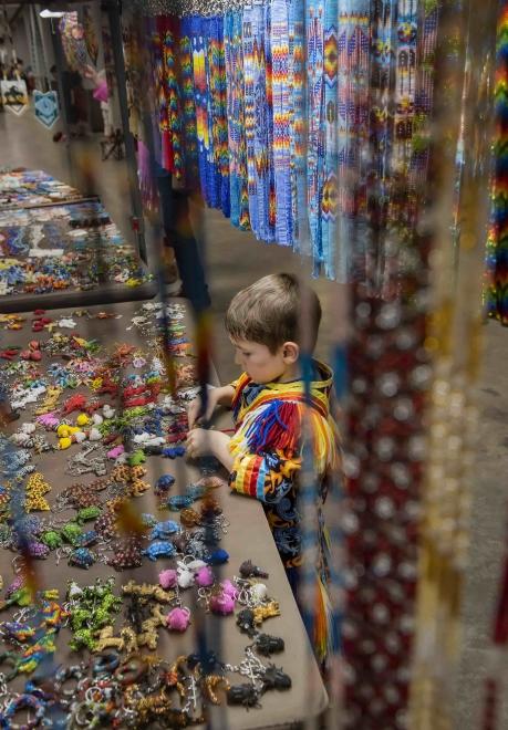 Child with Native American art (vertical)