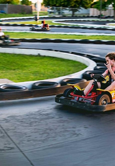 Teen driving a go-kart at Thunder Road
