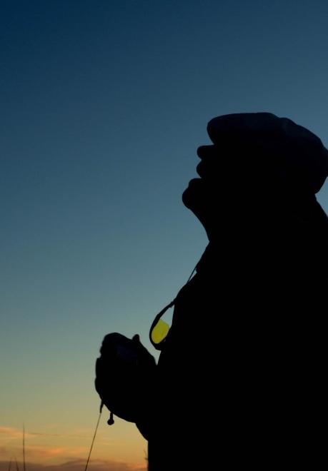 Man looking at the sky at dusk